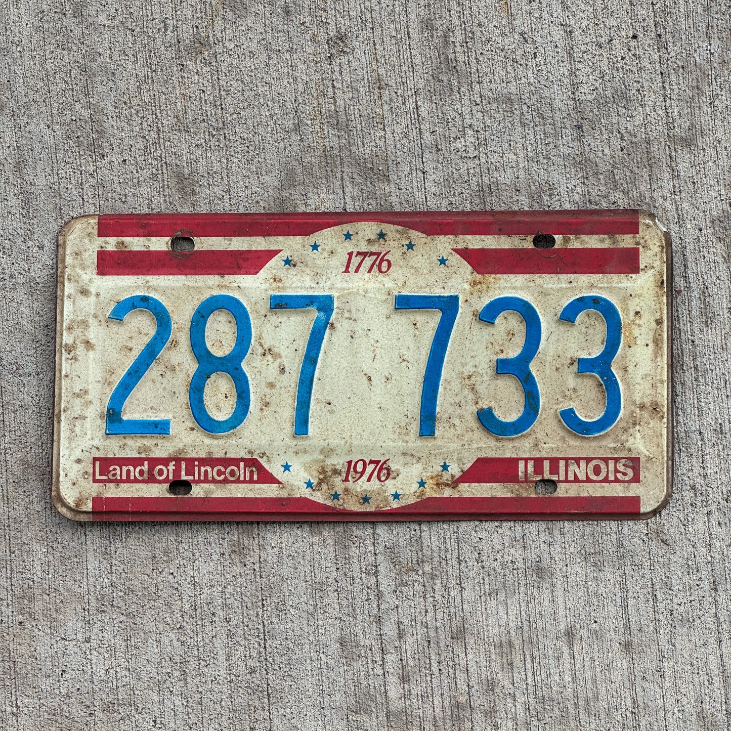 Photo of a 1976 Illinois License Plate Auto Tag 2 Vintage Garage Bicentennial 287 733 with original patina
