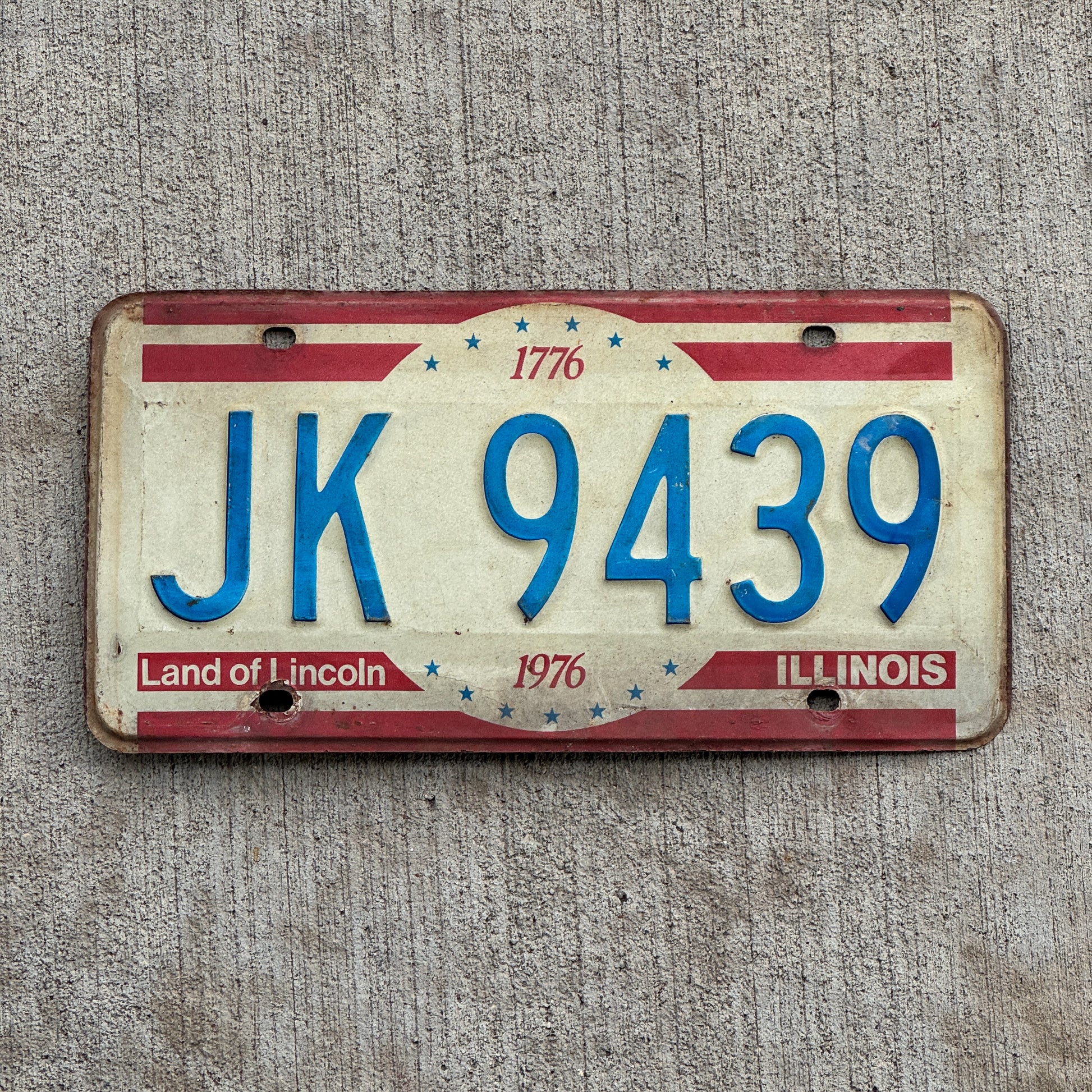 Photo of a 1976 Illinois License Plate Auto Tag 2 Vintage Garage Bicentennial JK 9439 with original patina