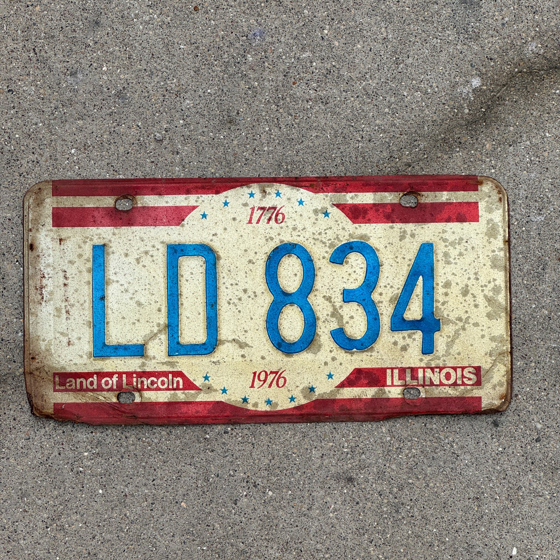 Photo of a 1976 Illinois License Plate Auto Tag 2 Vintage Garage Bicentennial LD 834 with original patina