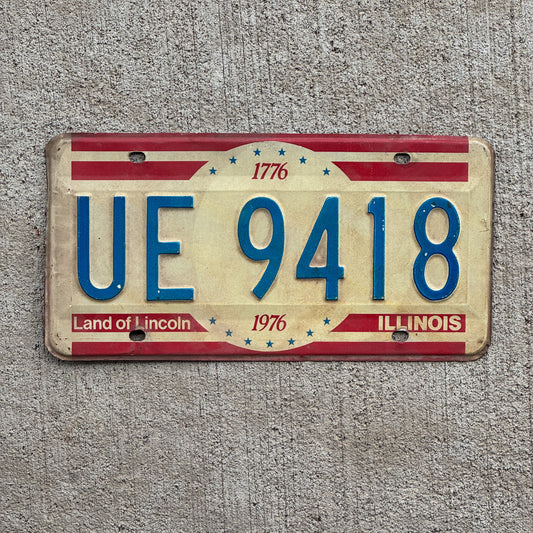 Photo of a 1976 Illinois License Plate Auto Tag 2 Vintage Garage Bicentennial UE 9418 with original patina