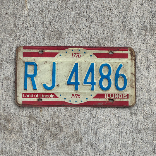 Photo of a 1976 Illinois License Plate Auto Tag Garage Decor Vintage Bicentennial RJ 4486 with original patina