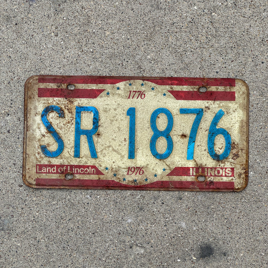 Photo of a 1976 Illinois License Plate Auto Tag Garage Decor Vintage Bicentennial SR 1876 with original patina