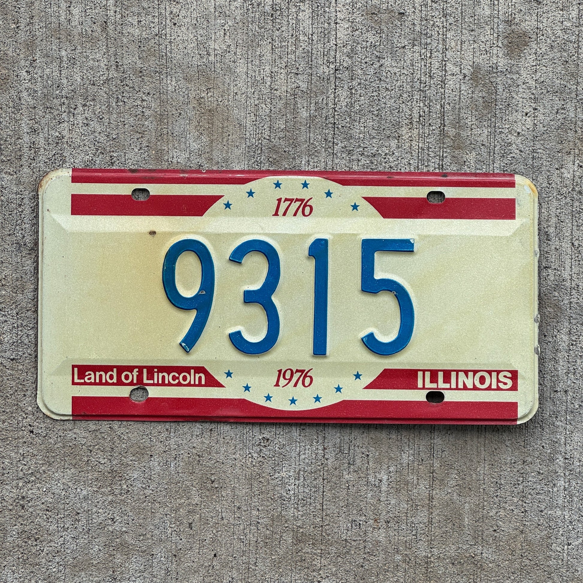 Photo of a 1976 Illinois License Plate Auto Tag Garage Decor Vintage Low Number Four Digit 9315 with original patina