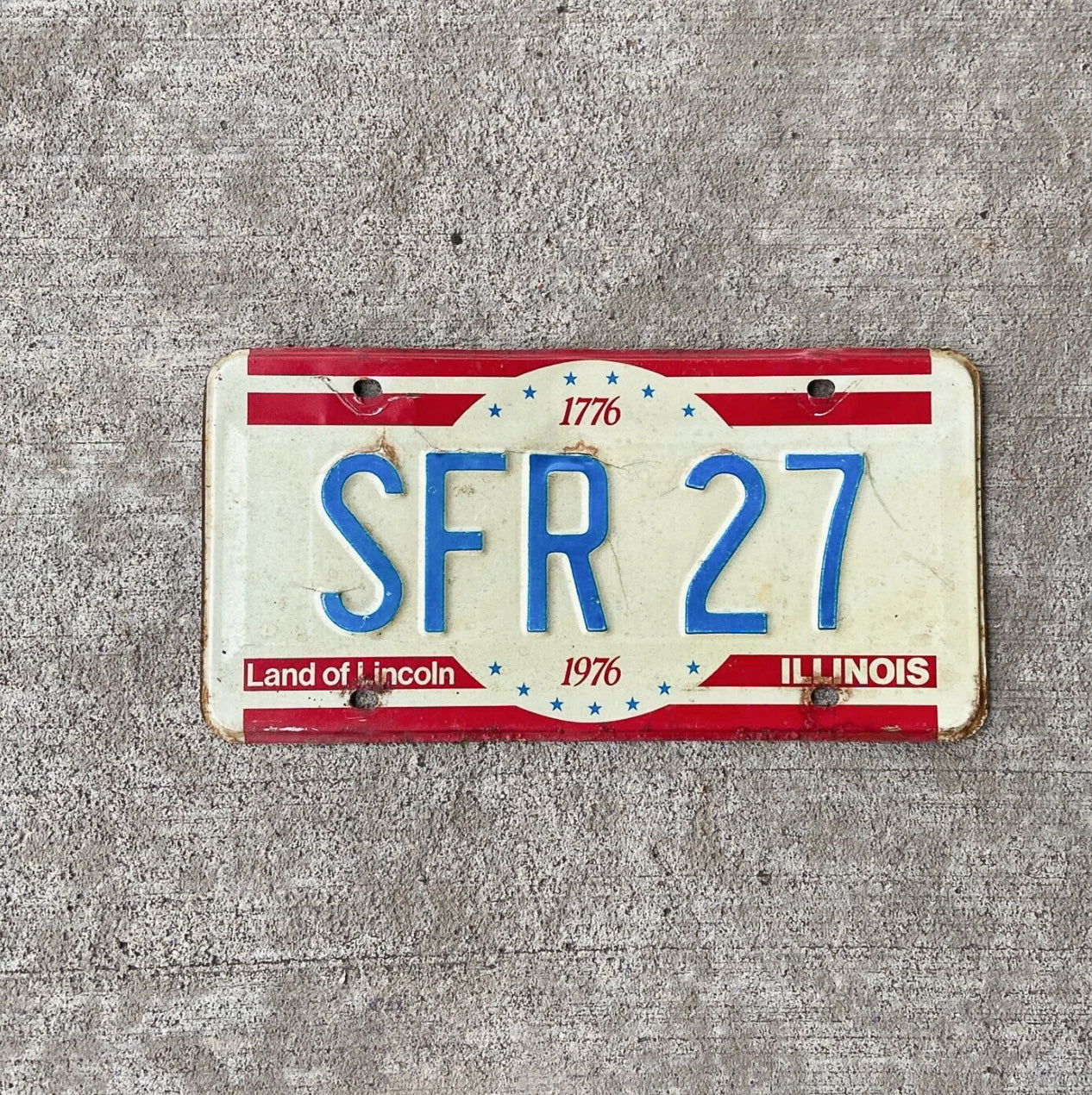 Photo of a 1976 Illinois License Plate Auto Tag Garage Decor Vintage SFR 27 with original patina