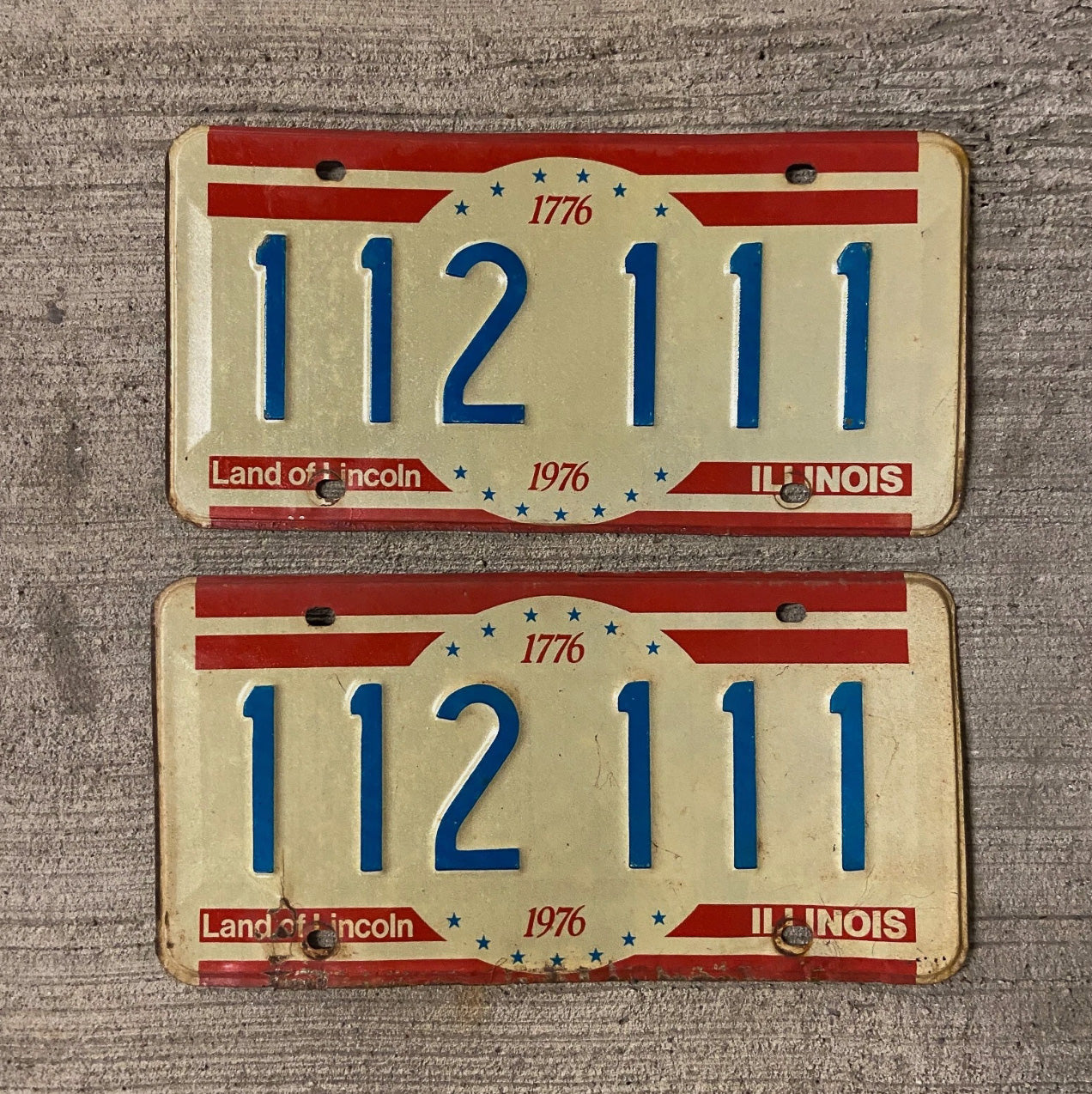 Photo of a 1976 Illinois License Plate Pair Auto Tag Garage Decor Vintage 111 Repeat Repeating 112 111 with original patina