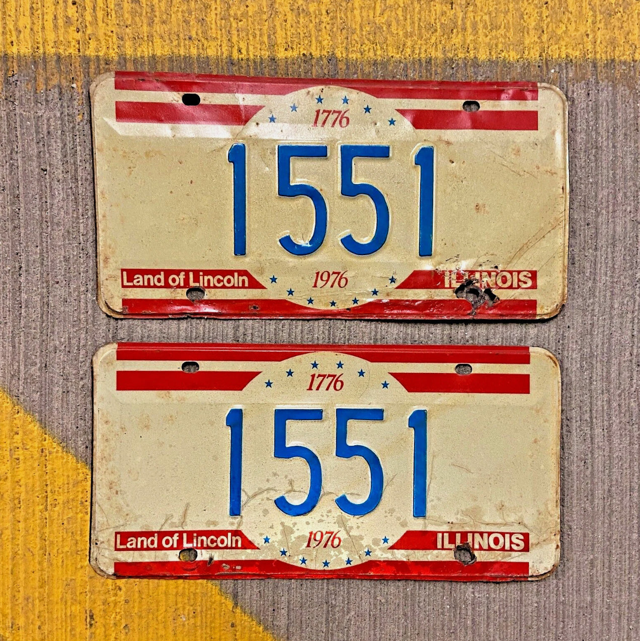Photo of a 1976 Illinois License Plate Pair Auto Tag Garage Decor Vintage Low Number Four Digit 1551 with original patina