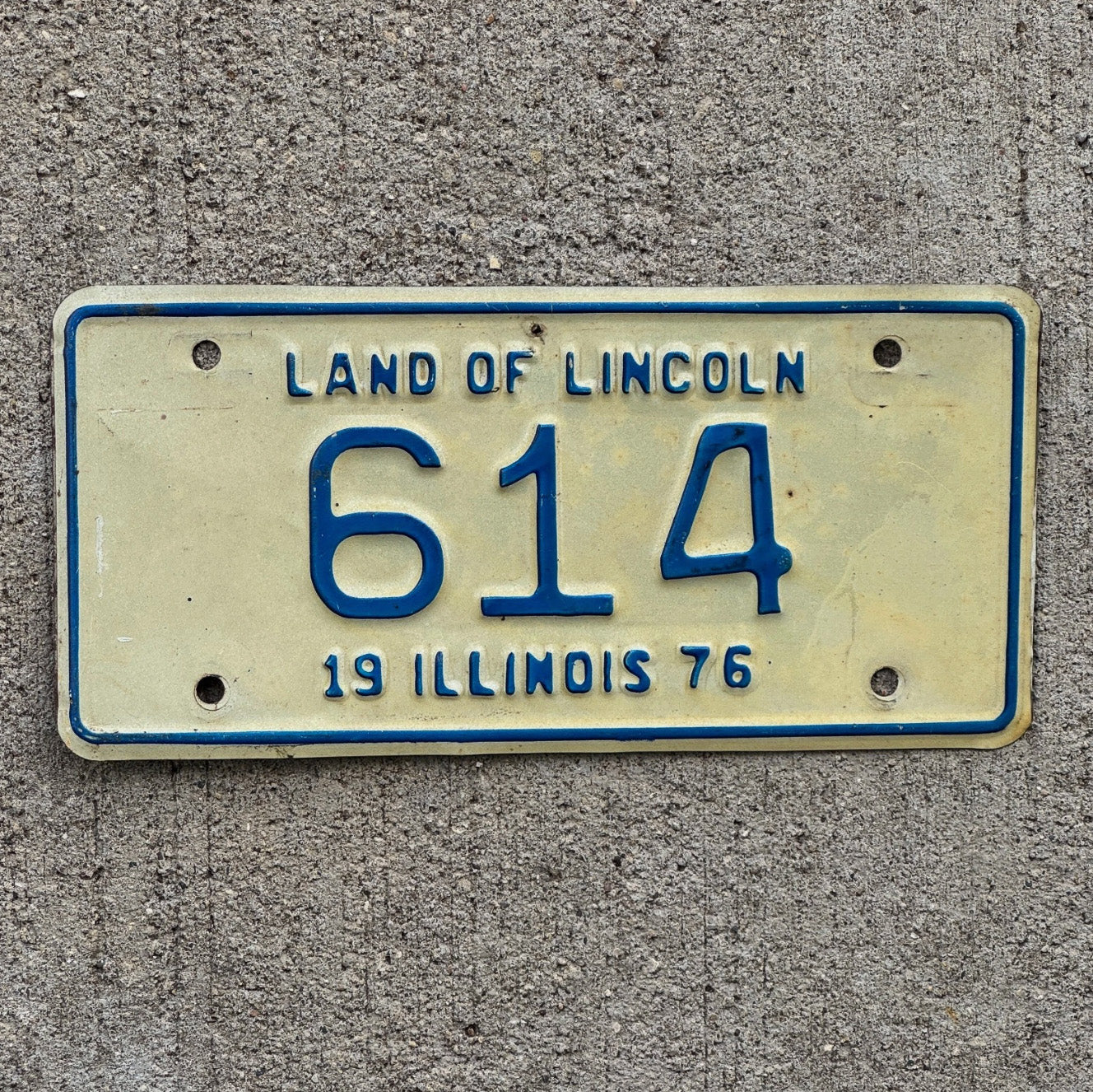 Photo of a 1976 Illinois Motorcycle License Plate Auto Tag Garage Decor Vintage Low Number Three Digit 614 with original patina