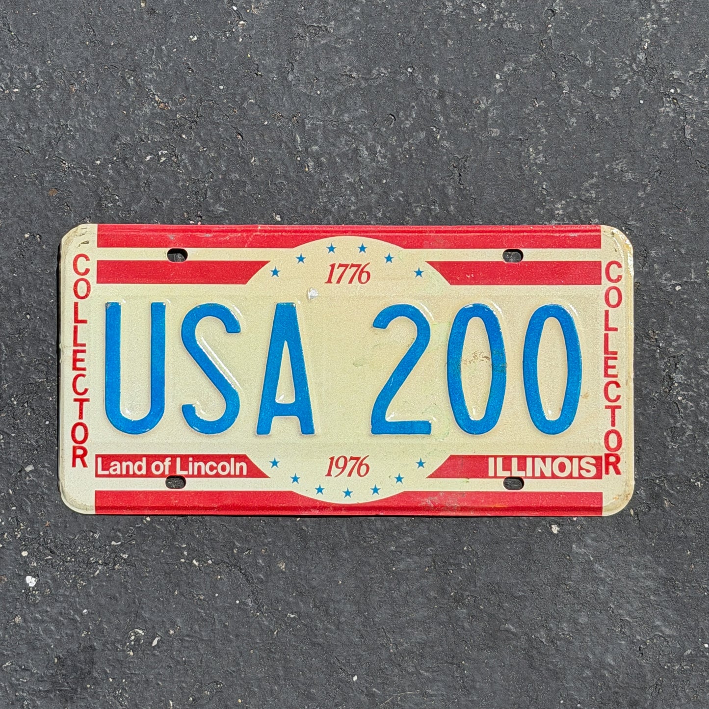 Photo of a 1976 Illinois Sample License Plate Auto Tag Garage Decor Vintage Bicentennial USA 200 with original patina