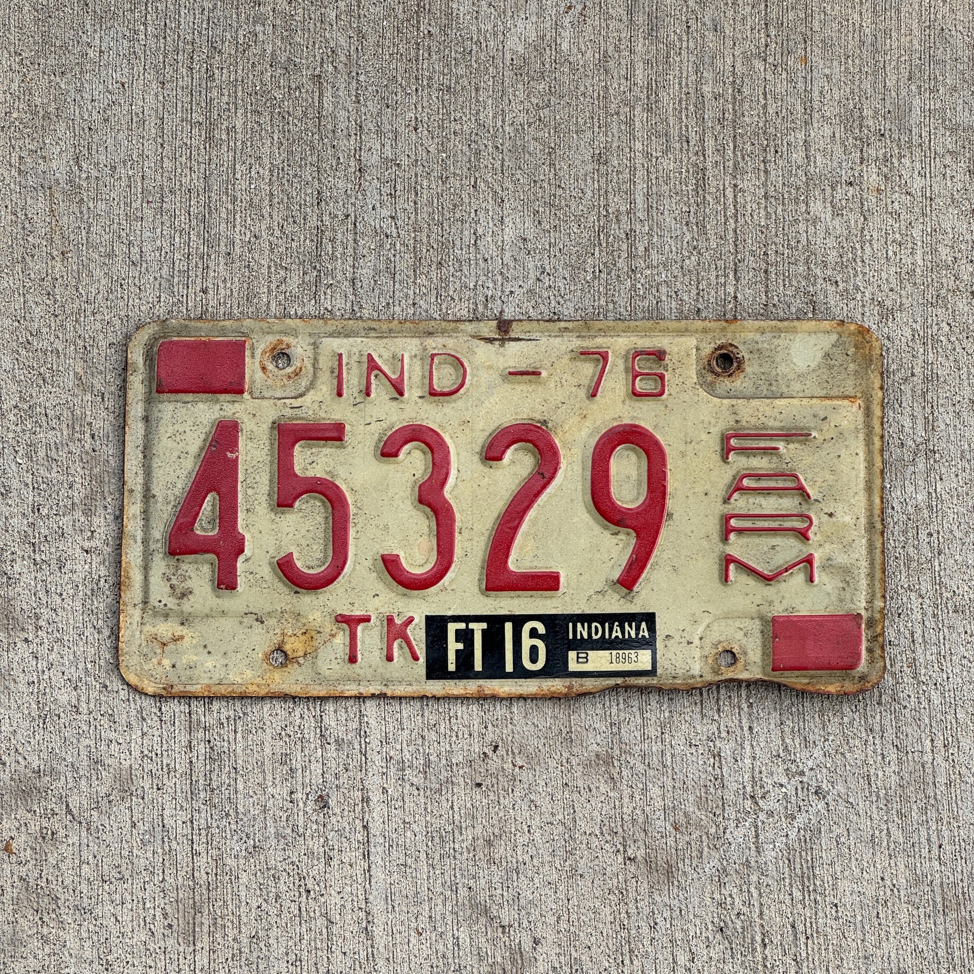 Photo of a 1976 Indiana Farm Truck License Plate Auto Tag Garage Decor Vintage 45329 with original patina