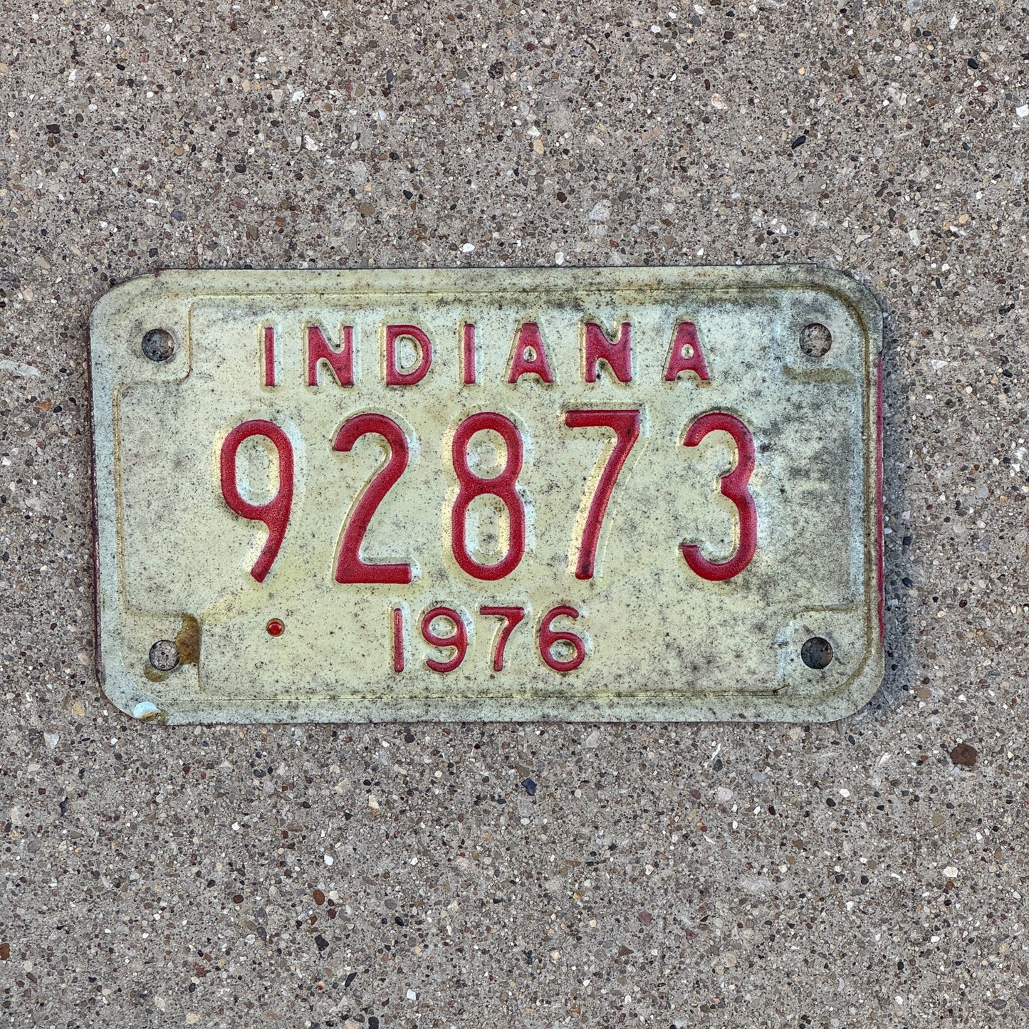 Photo of a 1976 Indiana Motorcycle License Plate Auto Tag Garage Decor Vintage 92873 with original patina