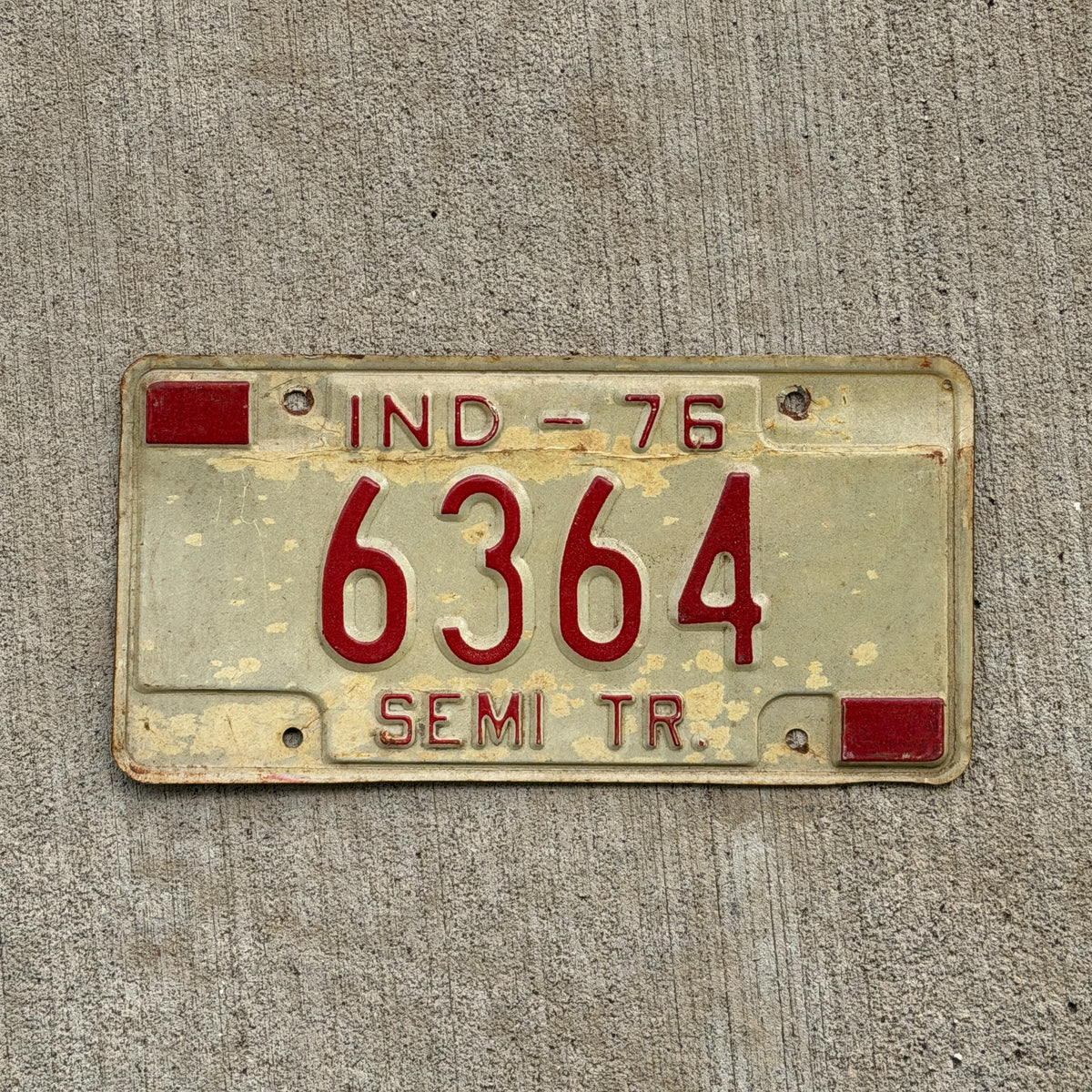Photo of a 1976 Indiana Semi Trailer License Plate Auto Tag Garage Decor Vintage 6364 with original patina