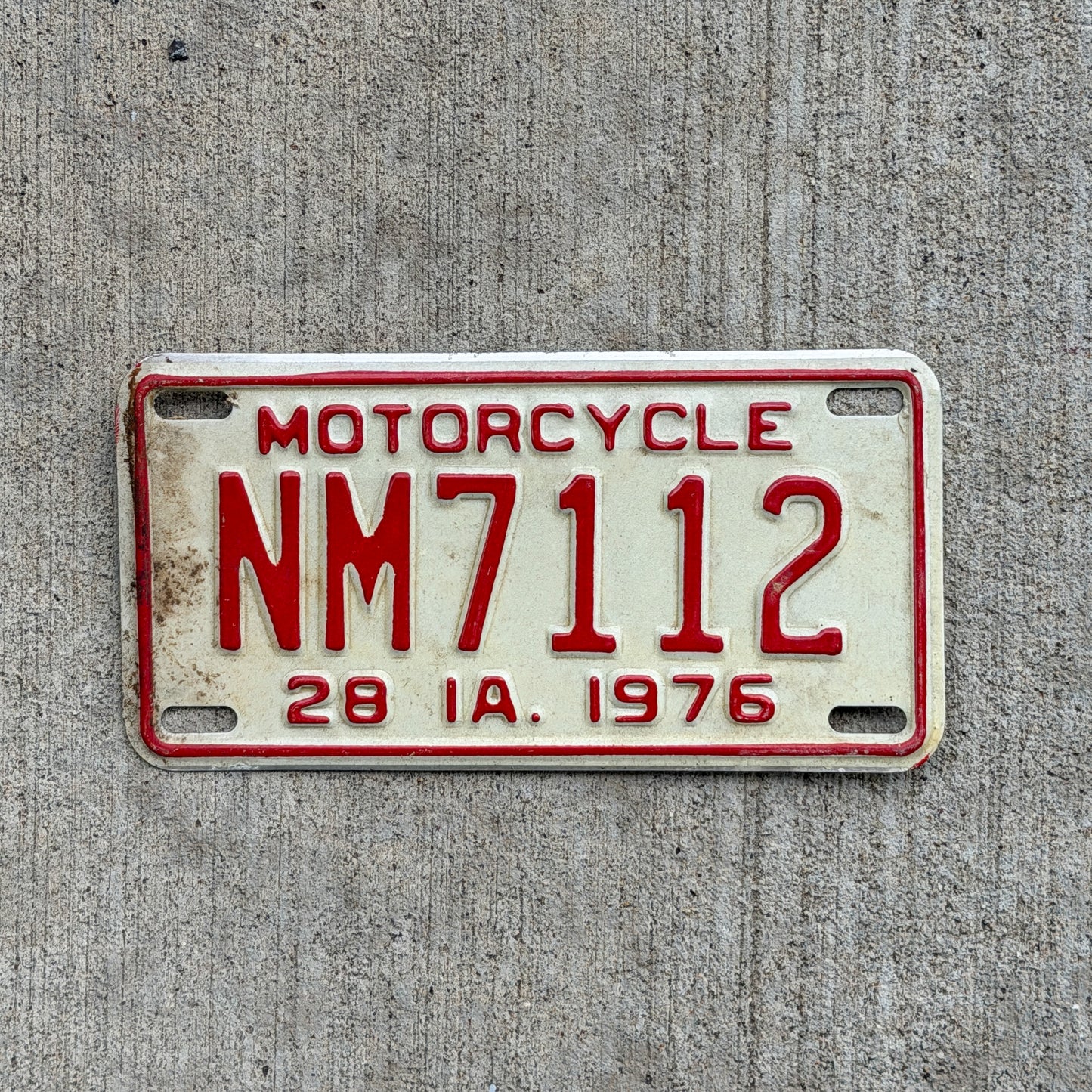Photo of a 1976 Iowa Motorcycle License Plate Auto Tag Garage Decor Vintage NM 7112 with original patina