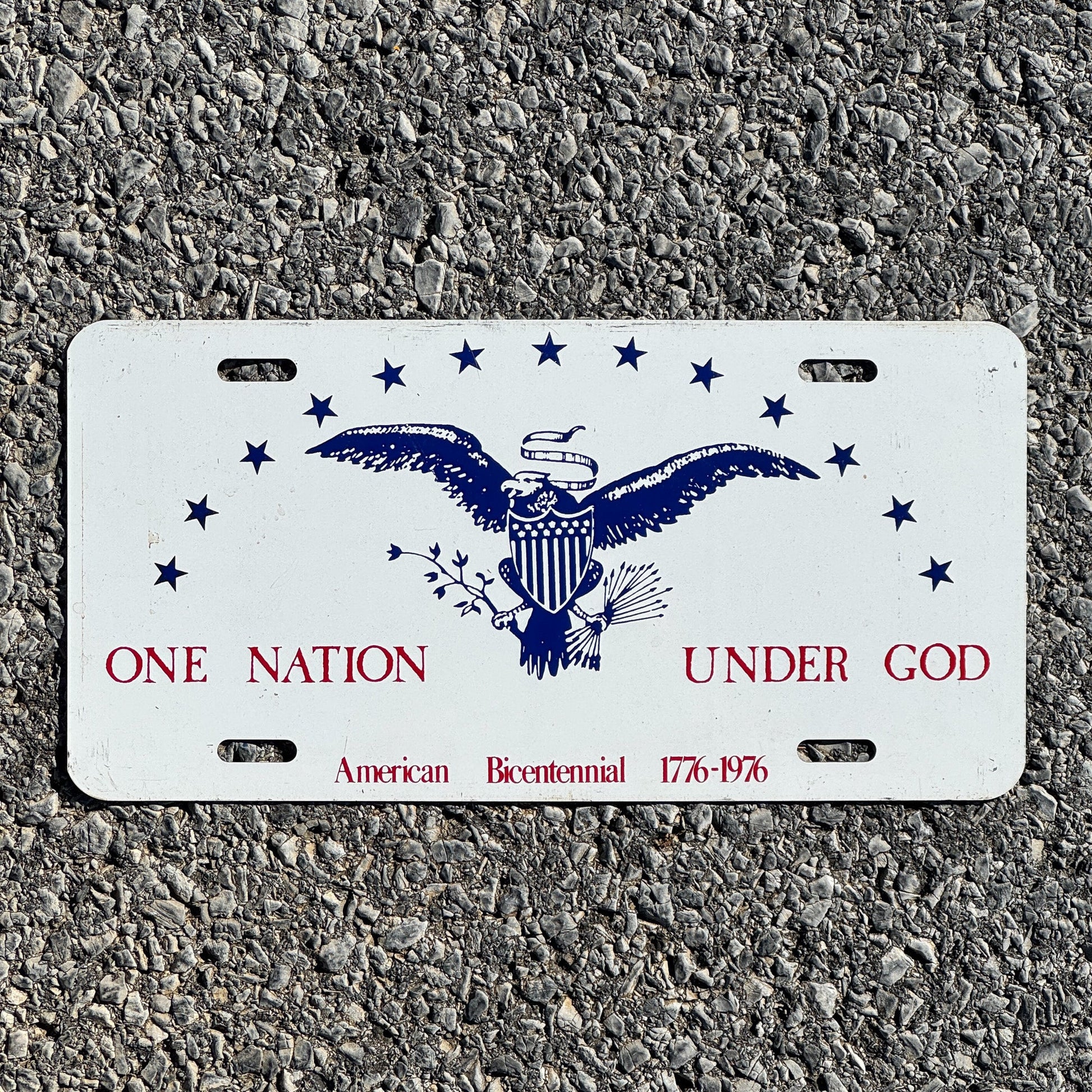 Photo of a 1976 License Plate Auto Tag Garage Decor Vintage One Nation Under God