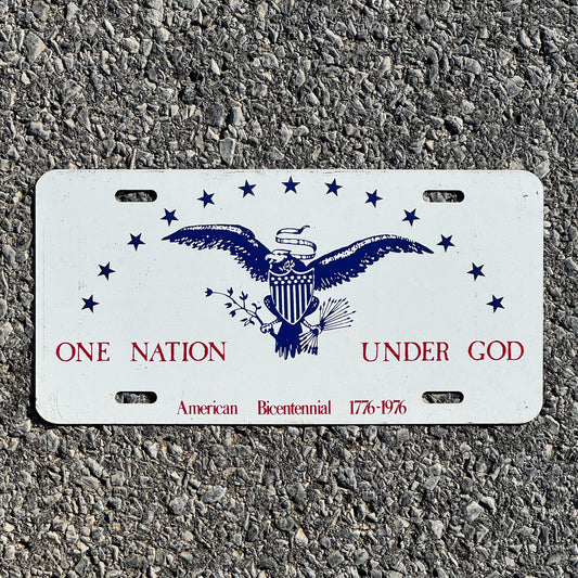 Photo of a 1976 License Plate Auto Tag Garage Decor Vintage One Nation Under God