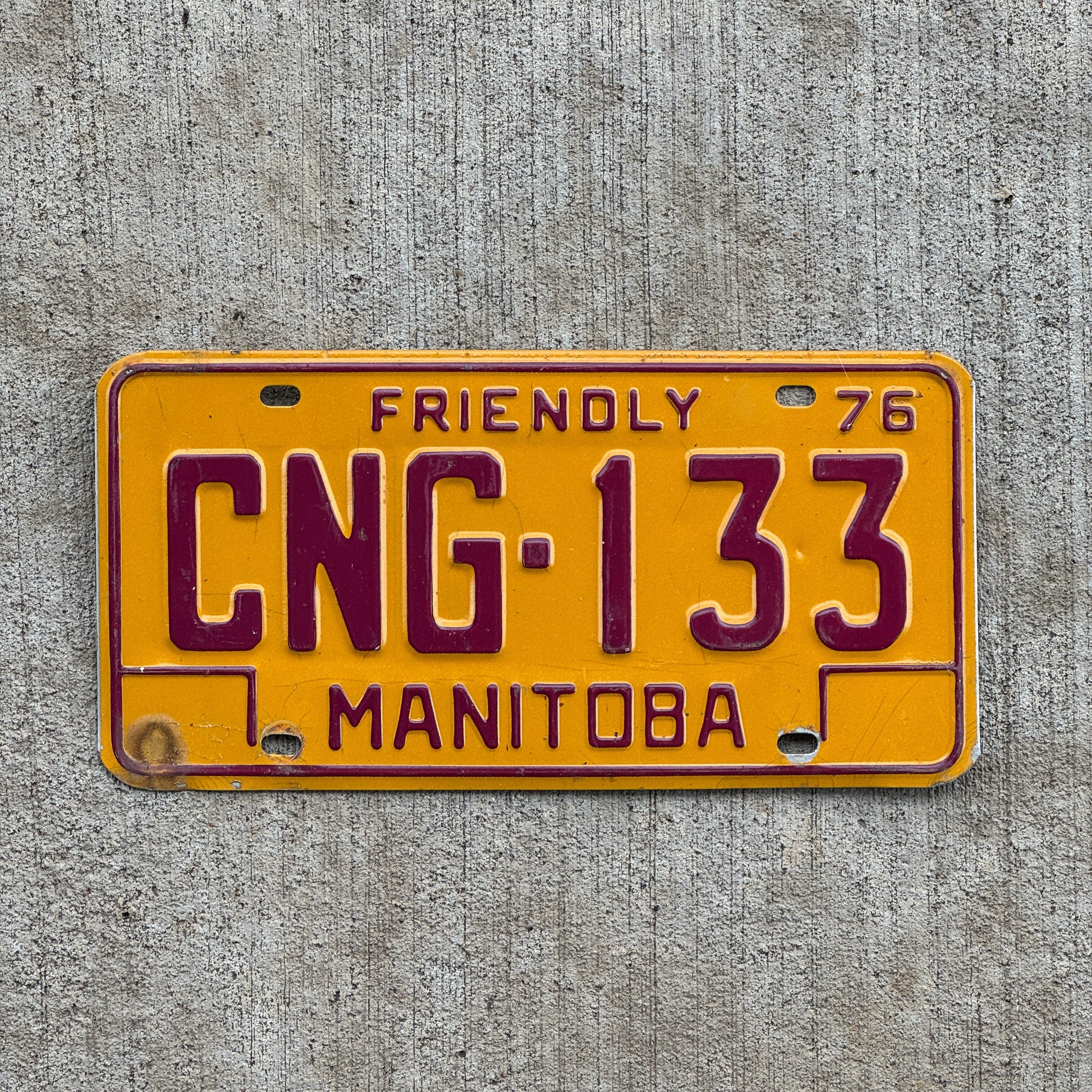 Photo of a 1976 Manitoba License Plate Auto Tag Garage Decor Vintage CNG 133 with original patina