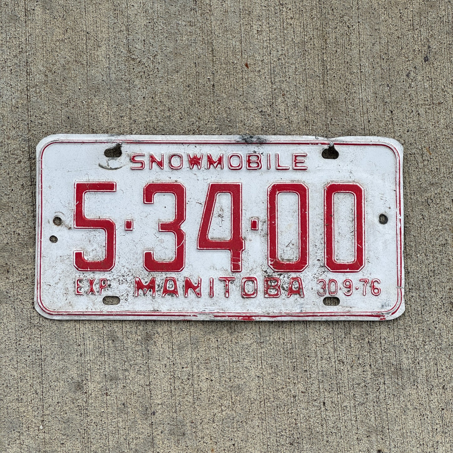 Photo of a 1976 Manitoba Snowmobile License Plate Auto Tag Garage Decor Vintage 5 34 00 with original patina