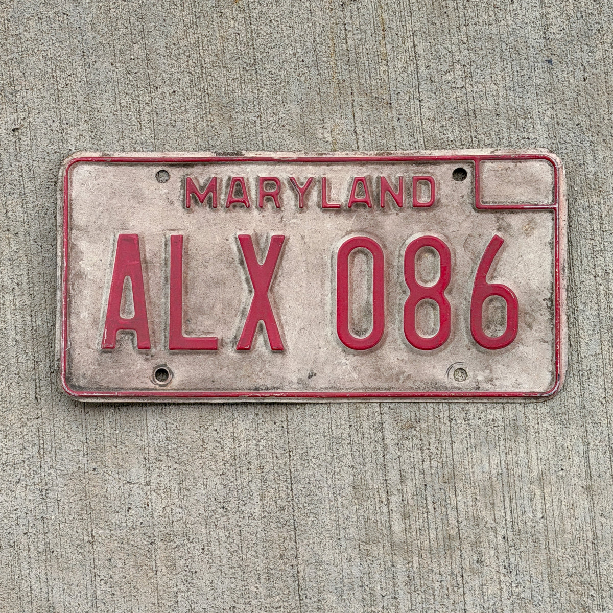Photo of a 1976 Maryland License Plate Auto Tag Garage Decor Vintage ALX 086 with original patina