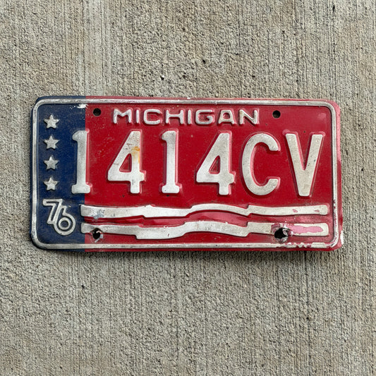Photo of a 1976 Michigan Commercial License Plate Auto Tag Garage Decor Vintage Bicentennial 1414 CV with original patina
