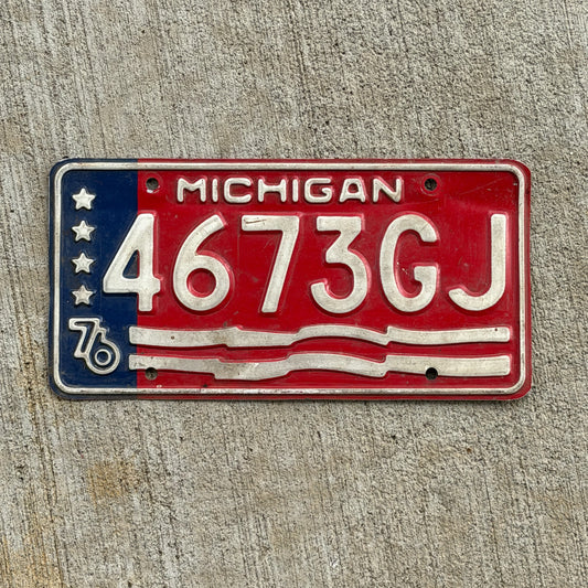 Photo of a 1976 Michigan Commercial License Plate Auto Tag Garage Decor Vintage Bicentennial 4673 GJ with original patina