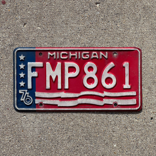 Photo of a 1976 Michigan License Plate Auto Tag 2 Vintage Garage American Flag Bicentennial FMP 861 with original patina