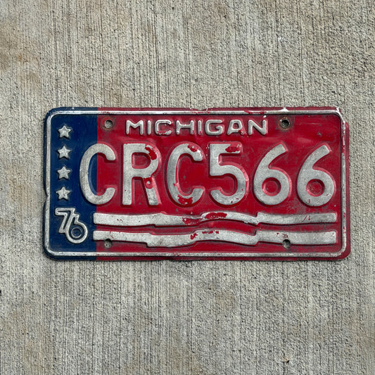 Photo of a 1976 Michigan License Plate Auto Tag Garage Decor Vintage Bicentennial CRC 566 with original patina