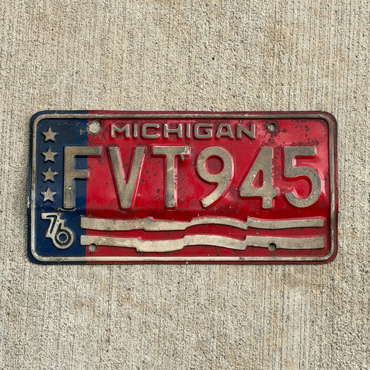 Photo of a 1976 Michigan License Plate Auto Tag Garage Decor Vintage Bicentennial FVT 945 with original patina
