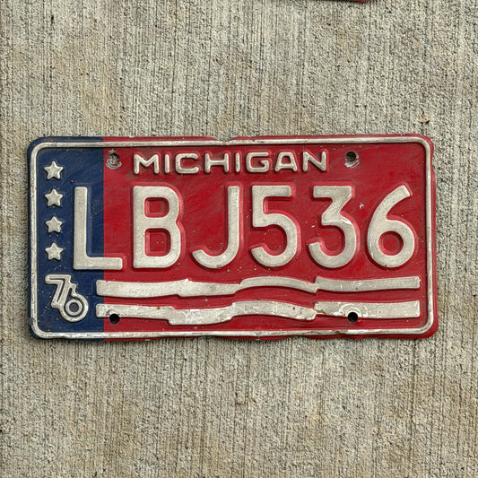 Photo of a 1976 Michigan License Plate Auto Tag Garage Decor Vintage Bicentennial LBJ 536 with original patina