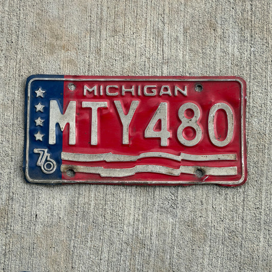 Photo of a 1976 Michigan License Plate Auto Tag Garage Decor Vintage Bicentennial MTY 480 with original patina
