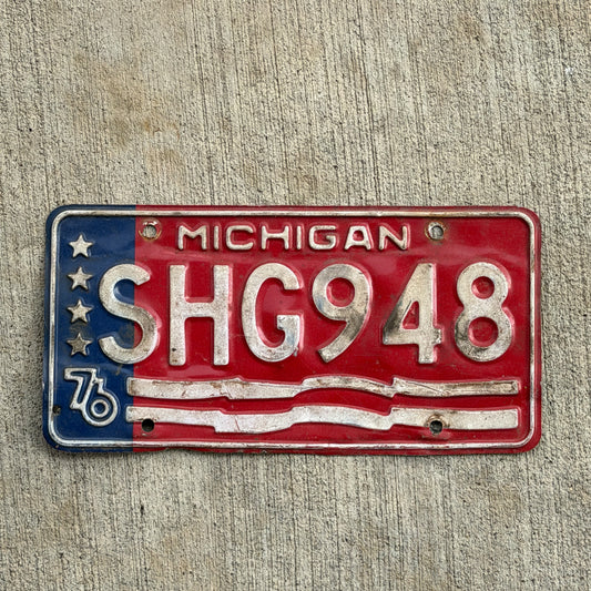 Photo of a 1976 Michigan License Plate Auto Tag Garage Decor Vintage Bicentennial SHG 948 with original patina