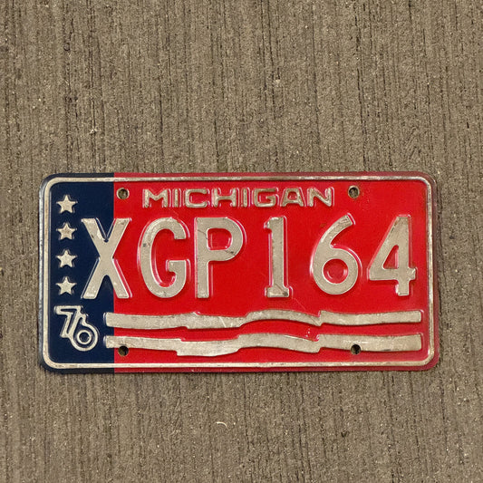 Photo of a 1976 Michigan License Plate Auto Tag Garage Decor Vintage Bicentennial XGP 164