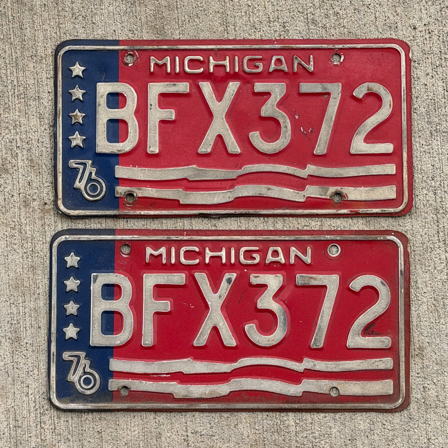 Photo of a 1976 Michigan License Plate Pair Auto Tag Garage Decor Vintage Bicentennial BFX 372 with original patina