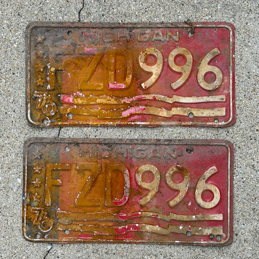 Photo of a 1976 Michigan License Plate Pair Auto Tag Garage Decor Vintage Bicentennial FZD 996 with original patina