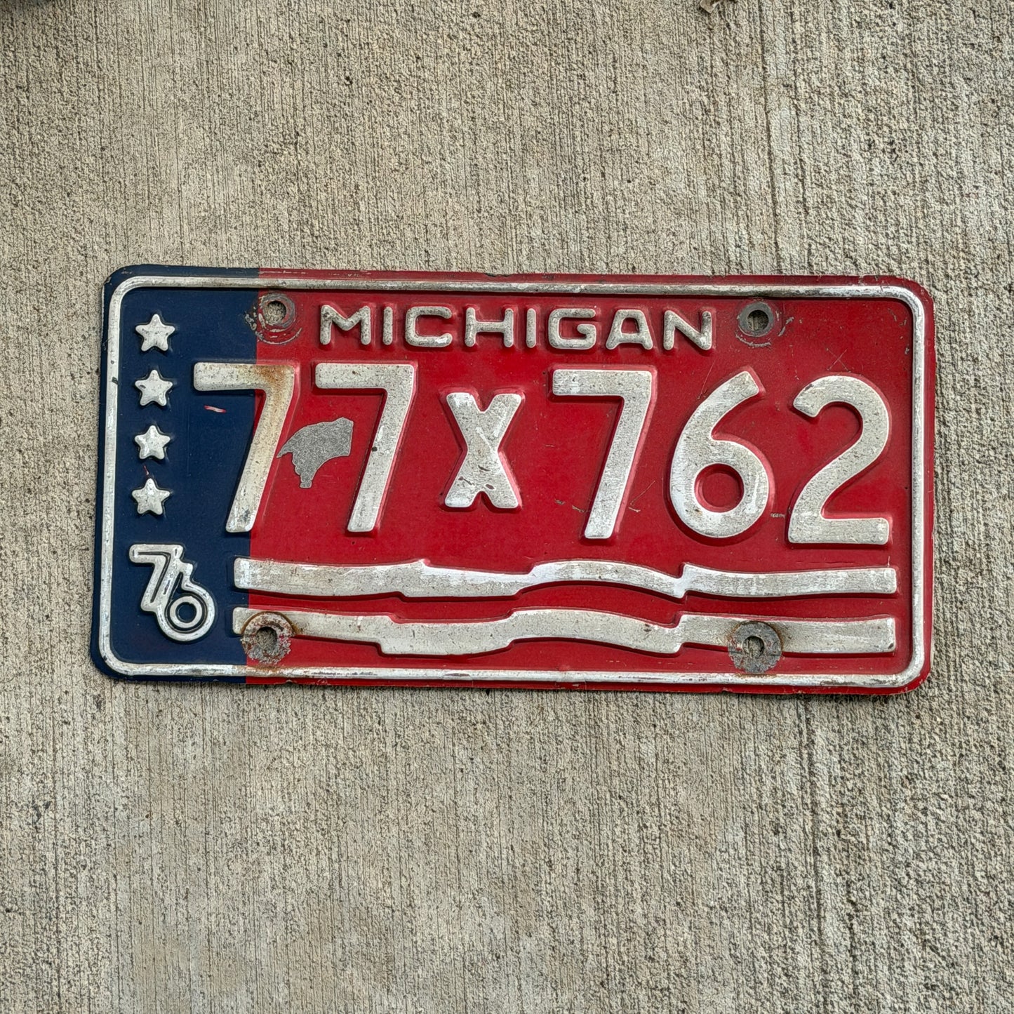 Photo of a 1976 Michigan Municipal License Plate Auto Tag Garage Decor Vintage Bicentennial 77 X 762 with original patina