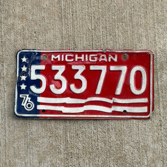 Photo of a 1976 Michigan Trailer License Plate Auto Tag Garage Decor Vintage Bicentennial 533 770 with original patina