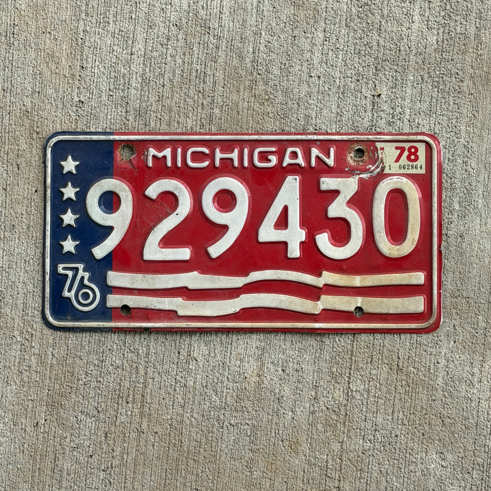 Photo of a 1976 Michigan Trailer License Plate Auto Tag Garage Decor Vintage Bicentennial 929 430 with original patina
