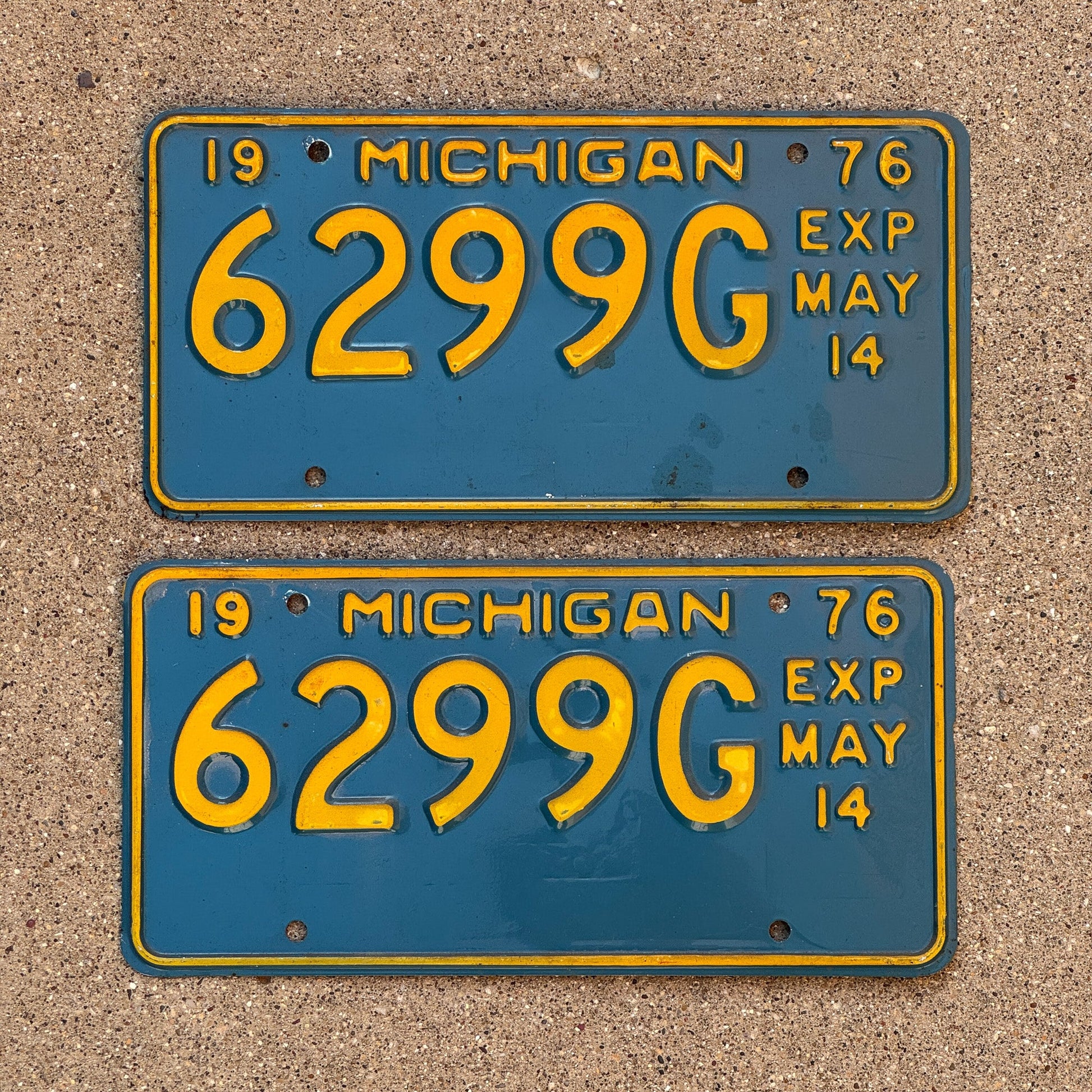Photo of a 1976 Michigan Truck Half Year License Plate Pair Auto Tag Garage Decor Vintage May 6299 G