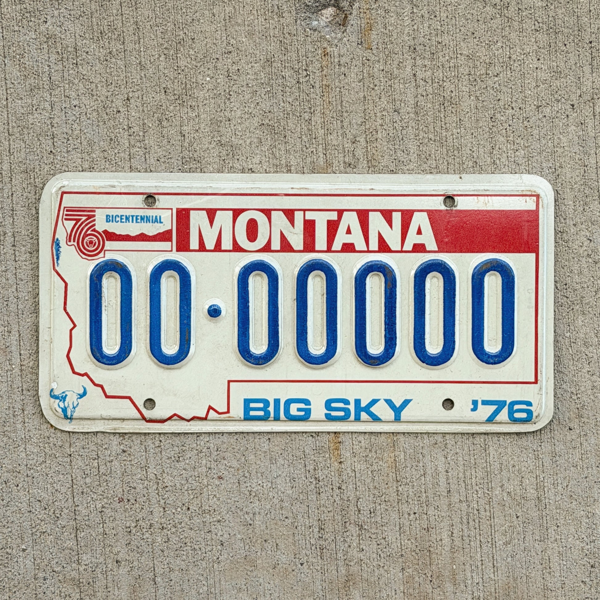 Photo of a 1976 Montana Sample License Plate Auto Tag Garage Decor Vintage Bicentennial 00 00000 with original patina