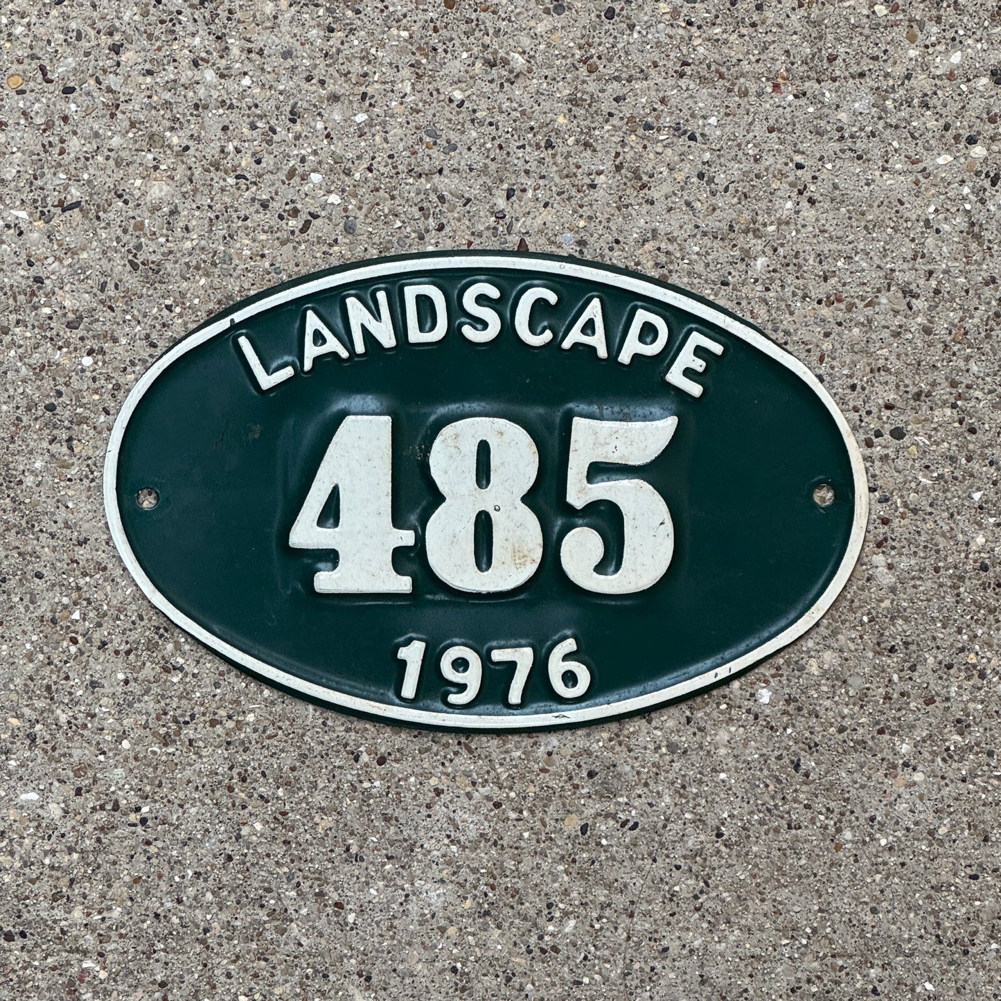 Photo of a 1976 New York Hempstead Landscape Permit License Plate Auto Tag Garage Decor Vintage Oval 485 with original patina