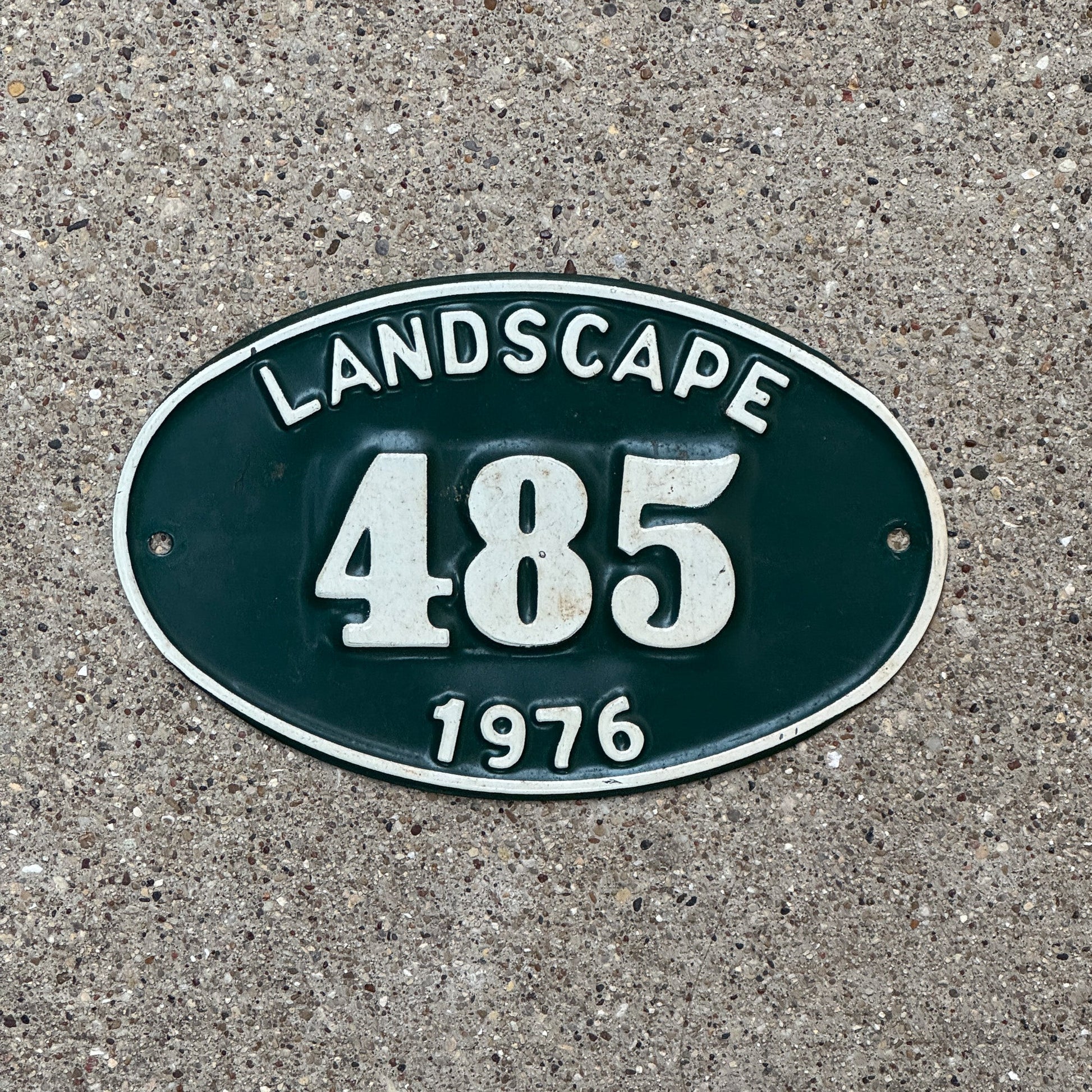 Photo of a 1976 New York Hempstead Landscape Permit License Plate Auto Tag Garage Decor Vintage Oval 485 with original patina