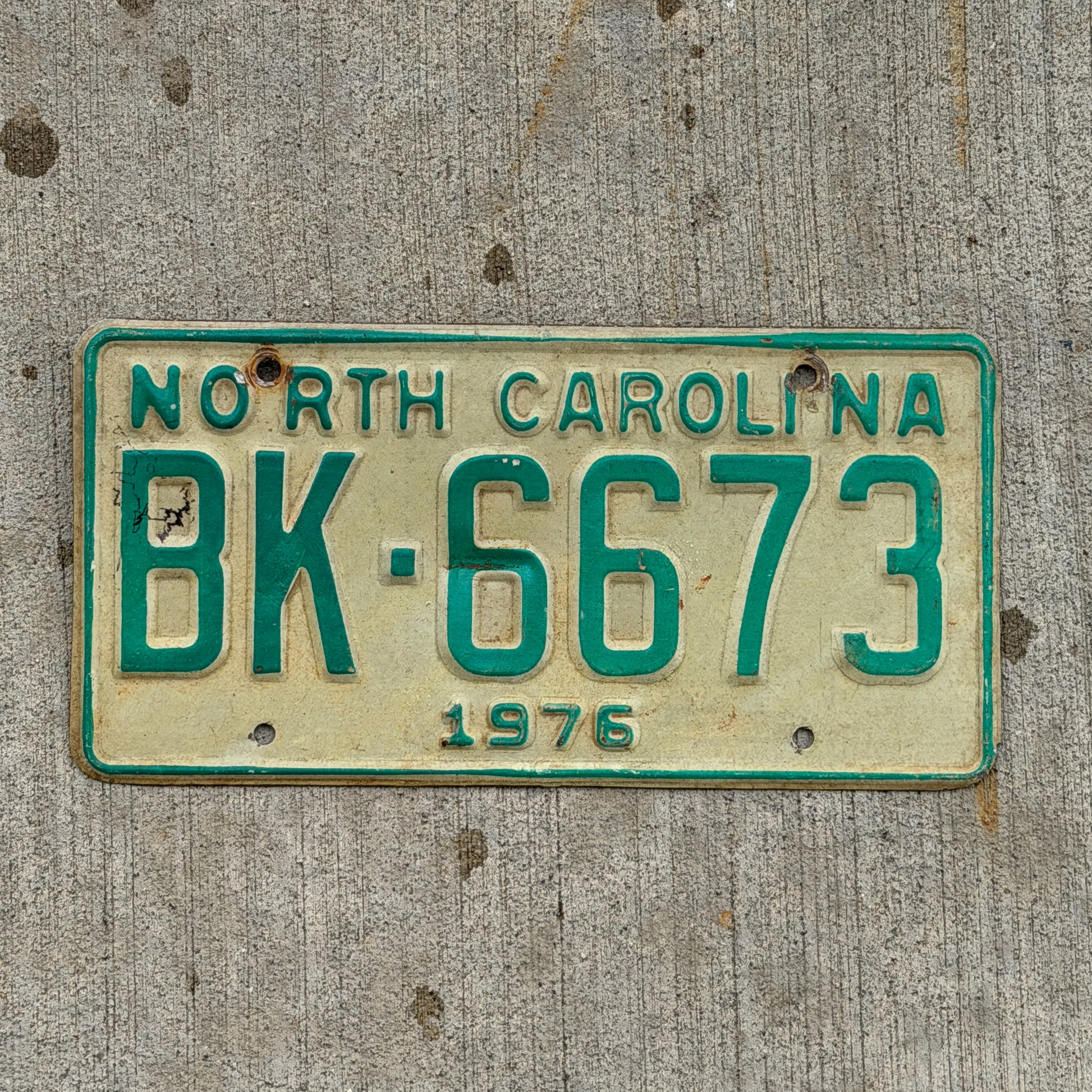 Photo of a 1976 North Carolina Truck License Plate Auto Tag Garage Decor Vintage BK 6673 with original patina