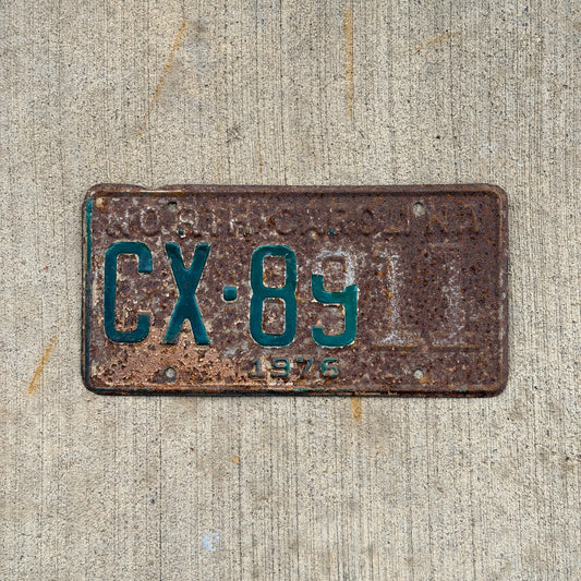 Photo of a 1976 North Carolina Truck License Plate Auto Tag Garage Decor Vintage CX 8911 with original patina