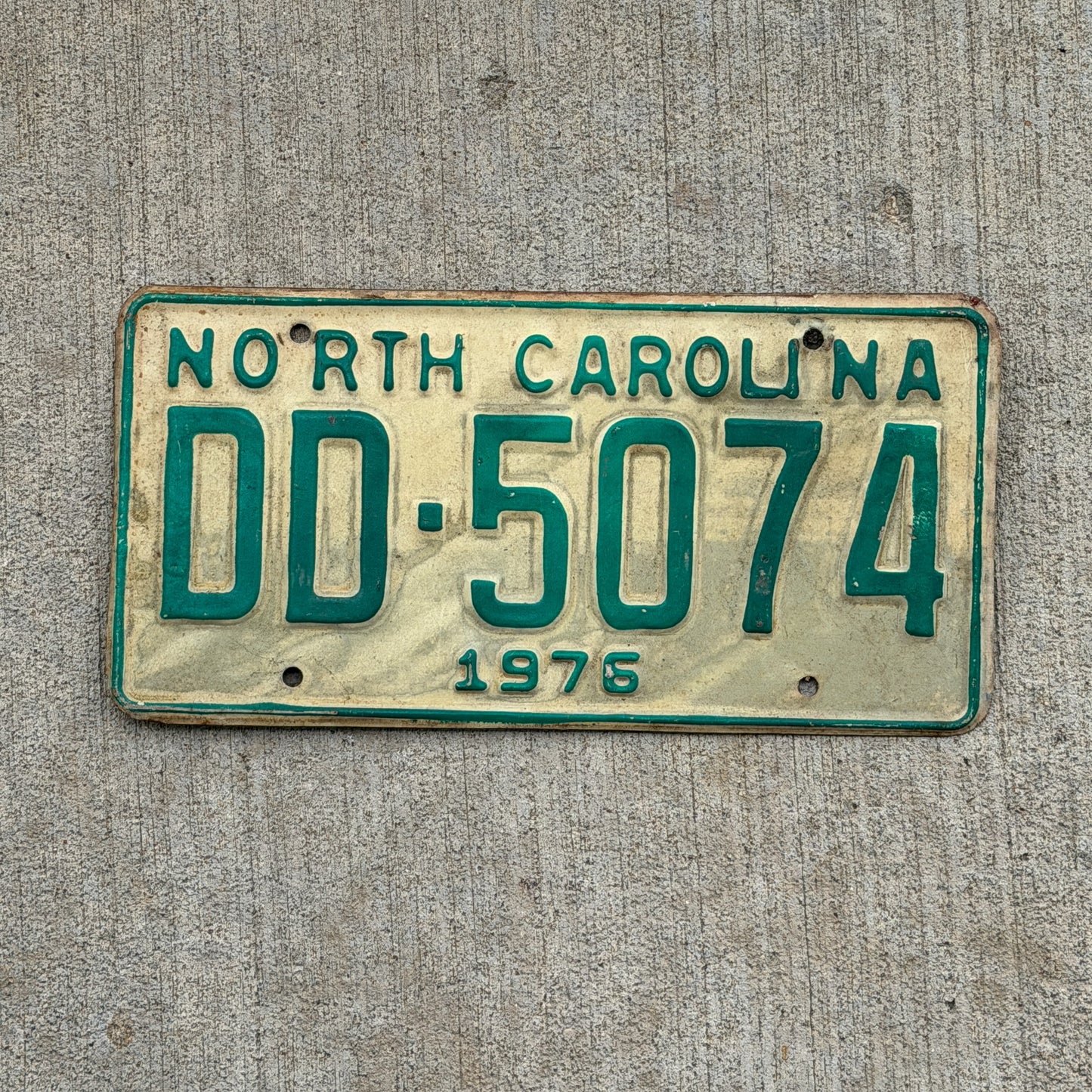 Photo of a 1976 North Carolina Truck License Plate Auto Tag Garage Decor Vintage DD 5074 with original patina