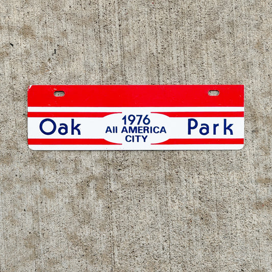 Photo of a 1976 Oak Park Illinois License Plate Topper Auto Tag Garage Decor Vintage All American City with original patina
