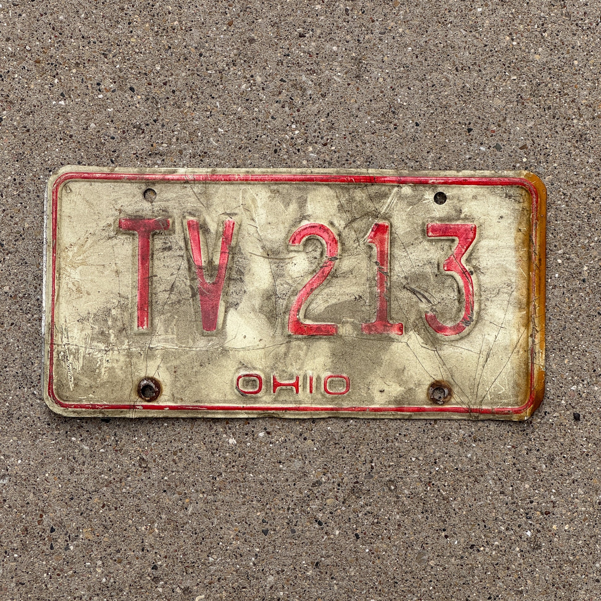 Photo of a 1976 Ohio License Plate Auto Tag 1 Vintage Garage TV 213 with original patina