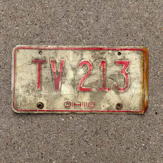 Photo of a 1976 Ohio License Plate Auto Tag 1 Vintage Garage TV 213 with original patina