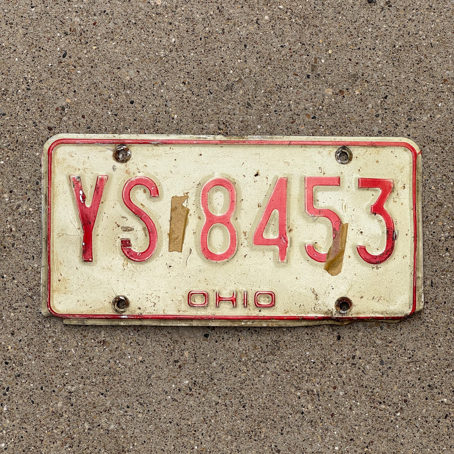 Photo of a 1976 Ohio License Plate Auto Tag 1 Vintage Garage YS 8453 with original patina