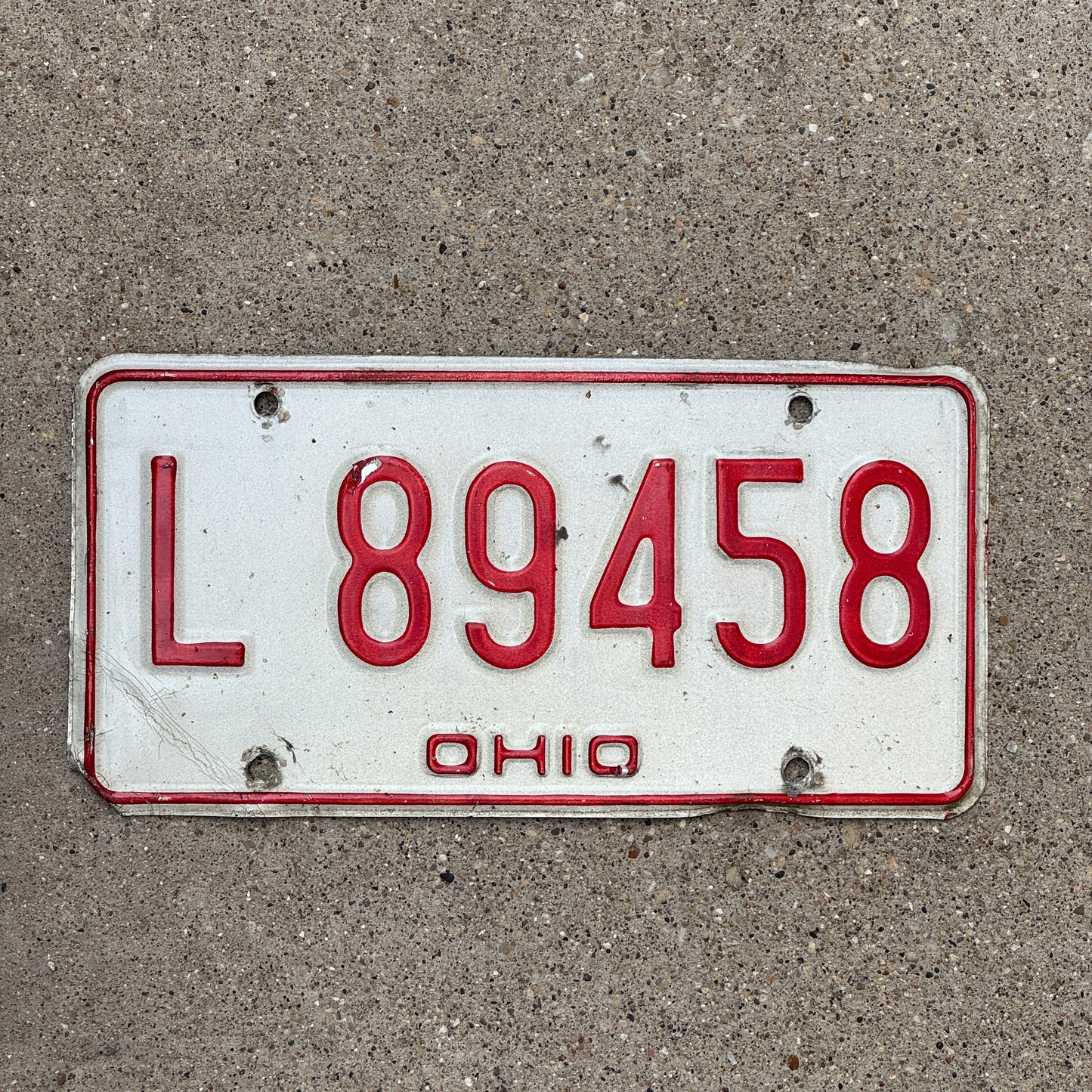 Photo of a 1976 Ohio License Plate Auto Tag 2 Vintage Garage L 89458 with original patina