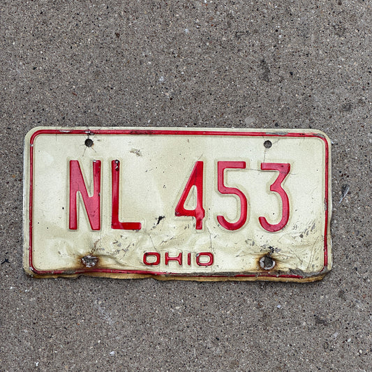 Photo of a 1976 Ohio License Plate Auto Tag 2 Vintage Garage NL 453 with original patina