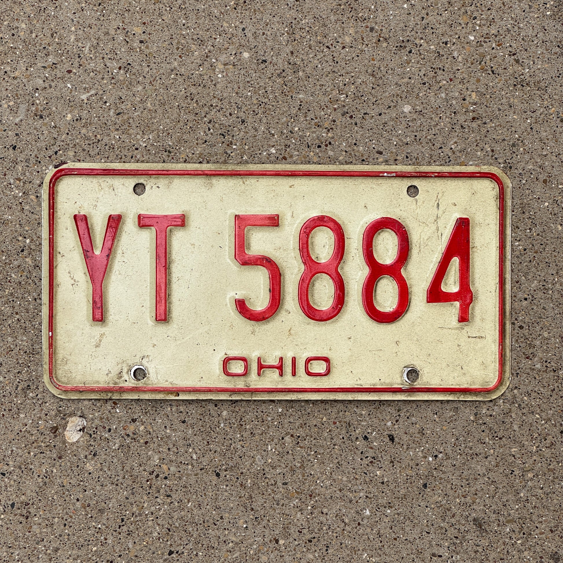 Photo of a 1976 Ohio License Plate Auto Tag 2 Vintage Garage YT 5884 with original patina