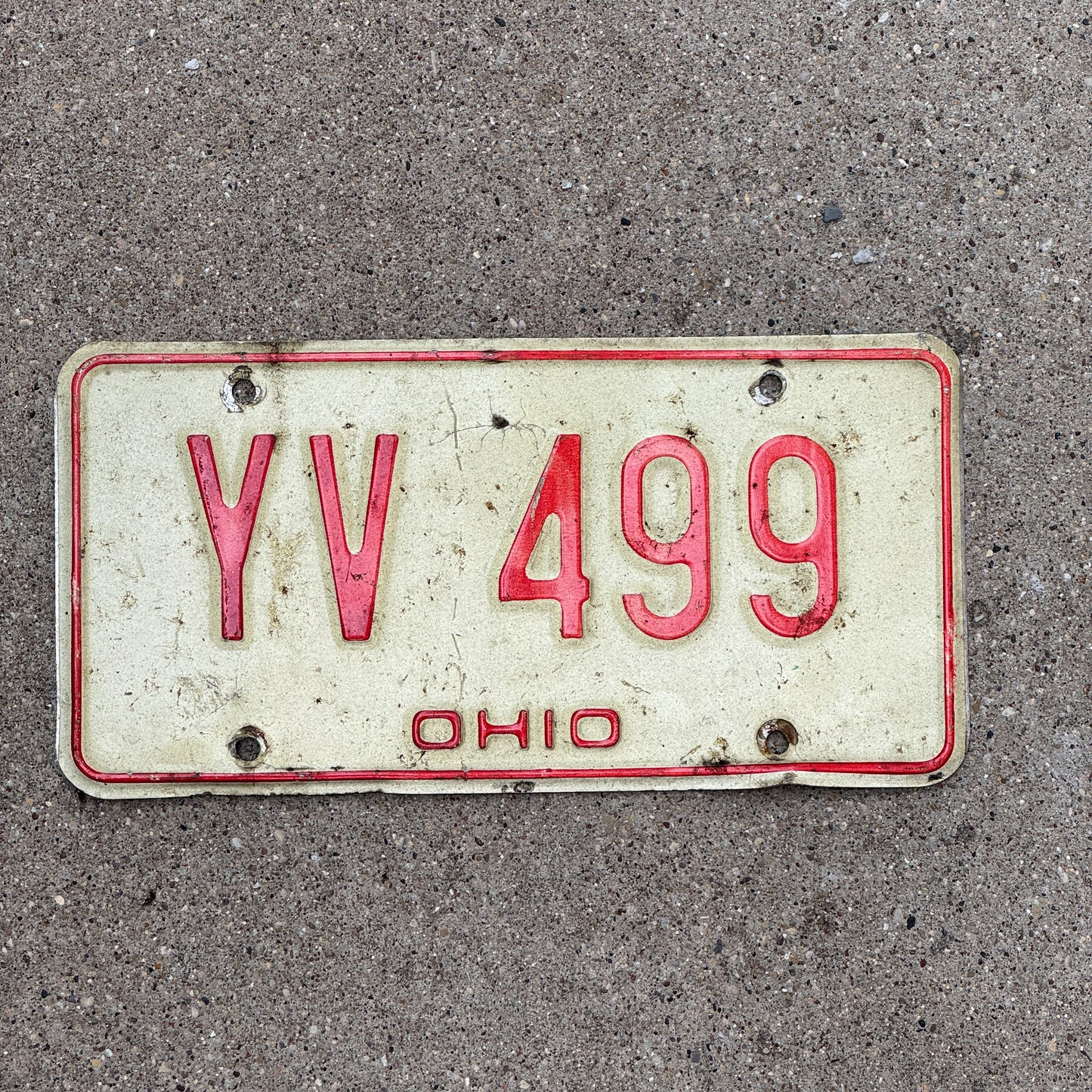 Photo of a 1976 Ohio License Plate Auto Tag 2 Vintage Garage YV 499 with original patina